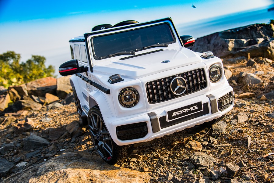 Kinderfahrzeug - Elektro Auto "Mercedes G63 AMG" - Lizenziert - 12V7AH Akku,2 Motoren- 2,4Ghz Fernsteuerung, MP3+Ledersitz+EVA-Weiss-18399