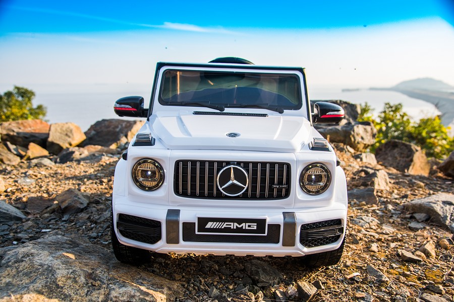 Kinderfahrzeug - Elektro Auto "Mercedes G63 AMG" - Lizenziert - 12V7AH Akku,2 Motoren- 2,4Ghz Fernsteuerung, MP3+Ledersitz+EVA-Weiss-18401